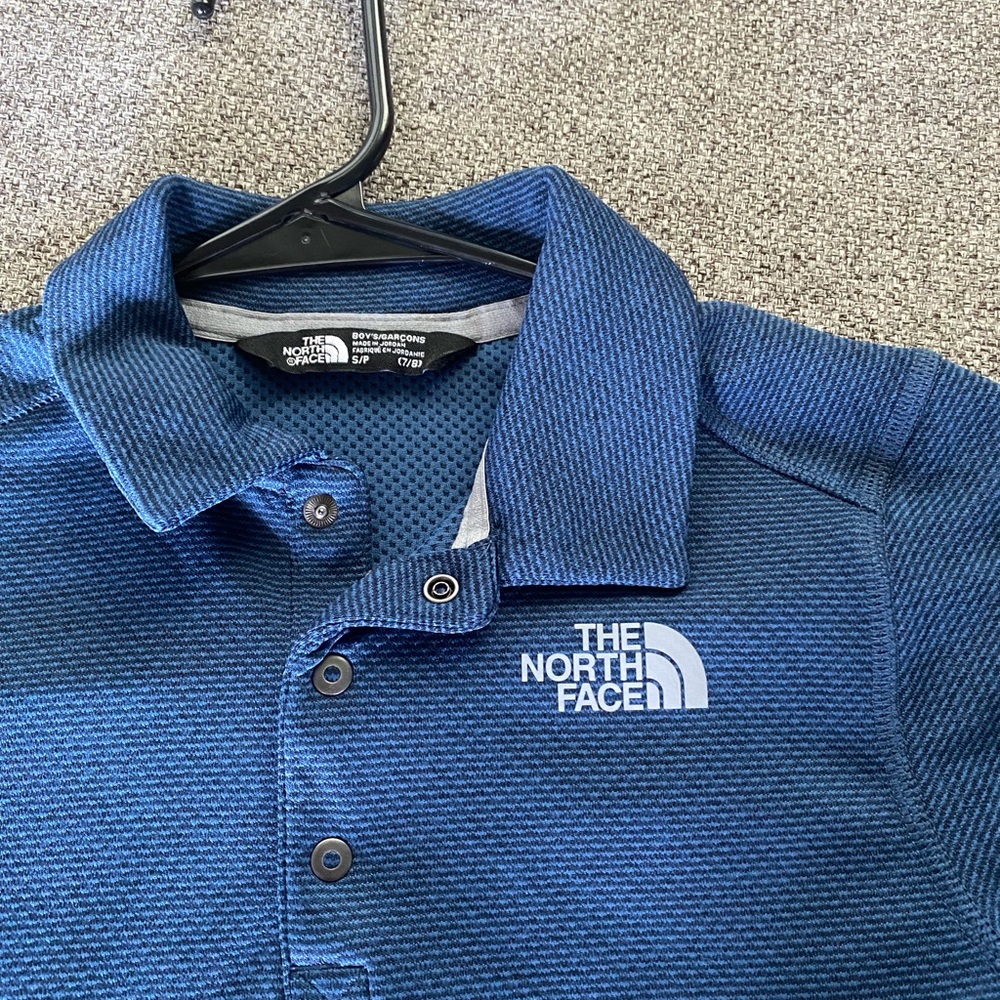 2 Boys shirts- periwinkle blue NorthFace and black/grey Under Armour